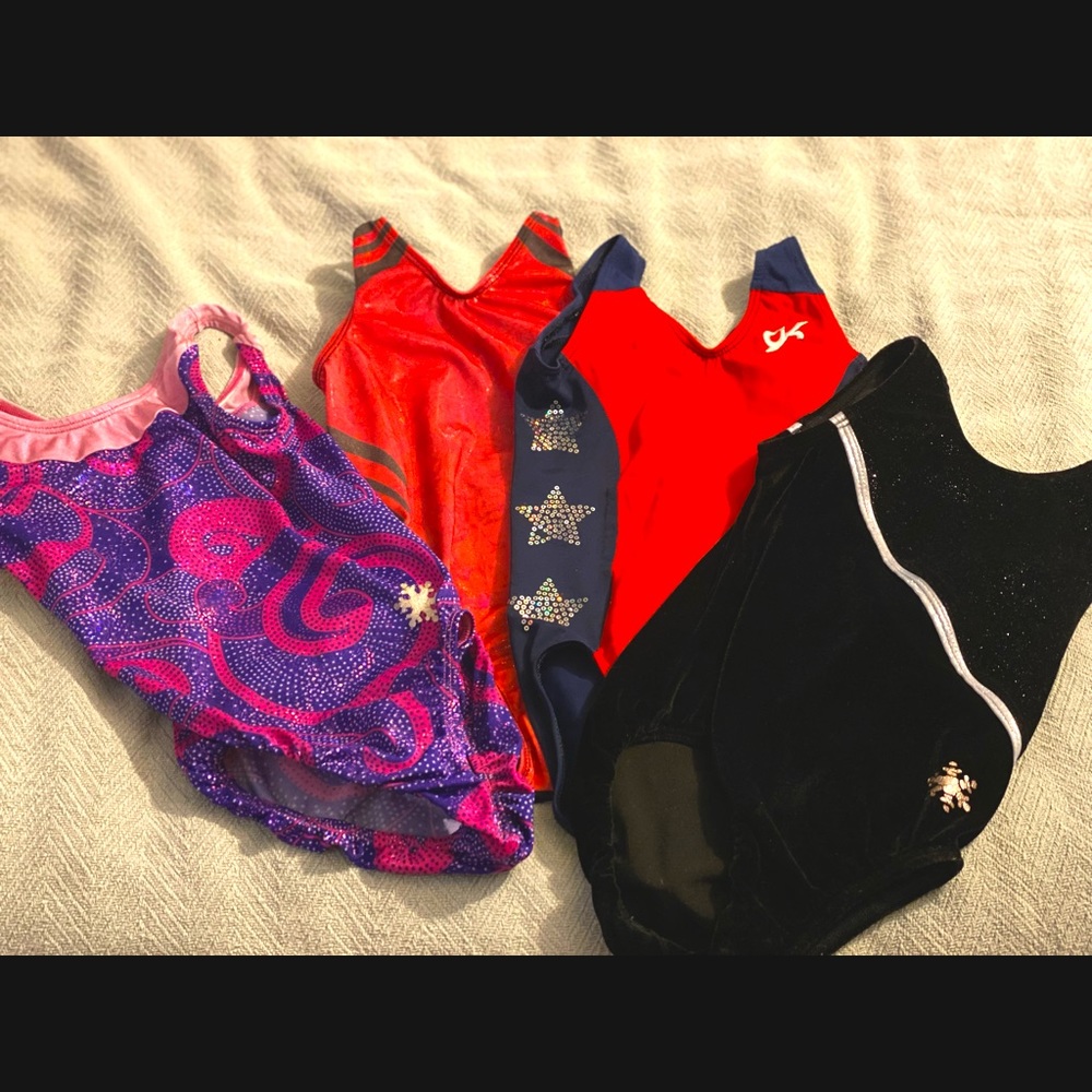Bundle of 4 girls small gymnastics leotards. Two are snowflake and two are GK.